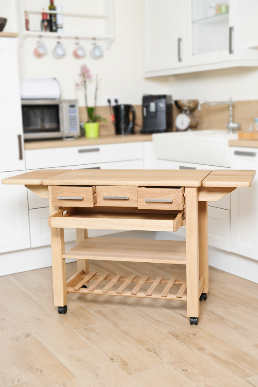 Küchenwagen Mobil 3 aus massiver Eiche. 90 x 50 x 81 cm mit Seitenklappen (Breite x Tiefe x Höhe) mit 3 Schubladen,Tablett, einem Boden und Flaschenablage, Seitenklappen zum ausklappen auf 140cm Breite