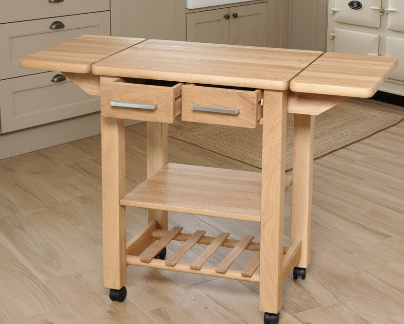 Küchenwagen Mobil 9 aus massiver Eiche. 64 x 50x 81cm (Breite x Tiefe x Höhe), 2 Schubladen, einem Boden und Flaschenablage, Ausklappbar auf 114 cm Breite 